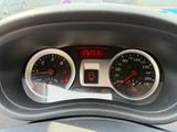 a close up of a car dashboard with gauges and speedometers