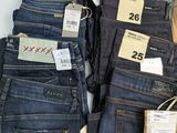 a lot of jeans that are on display in a store