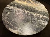 a marble table in the middle of a living room