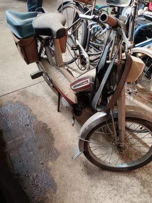 many bikes that are parked next to each other on the street