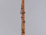 a clarinet with a wooden body and brass handles