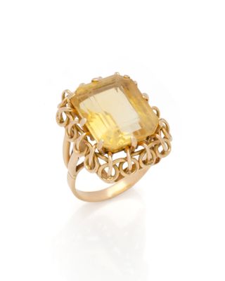 an 18k yellow gold ring set with a citrine stone