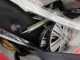 a suitcase with a wheel and a pair of scissors in it