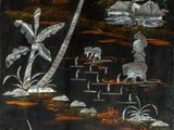 a painting on the wall of a building with a cow and palm trees