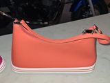a pair of shoes and a purse sitting on a table
