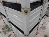 a close up of a metal fence with rust on it