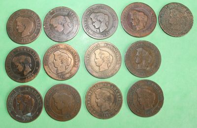 several different types of coins on a green surface