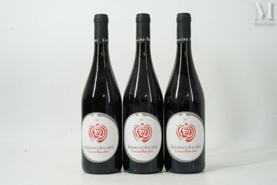 three bottles of wine sitting on top of a table next to each other