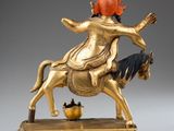 an image of a statue of a woman riding a horse with a pot in her hand