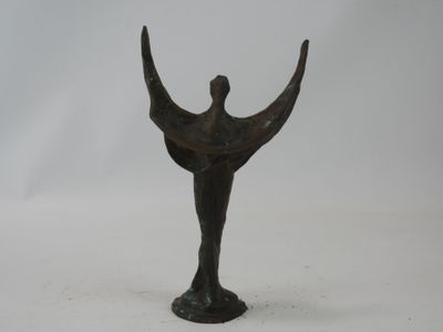 bronze statue of a man holding a bird on a pedestal