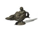 bronze figurine of a man riding a horse with a bird on its back