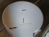 a white paper towel dispenser sitting on a counter