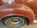 a close up of a car with a tire on it