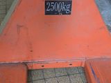 a large orange piece of equipment sitting on the floor