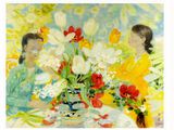 two women sitting at a table with flowers in a vase