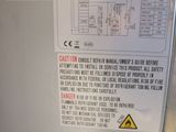an image of a refrigerator with a warning label on it