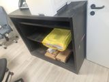 a small black cabinet with a printer on top of it
