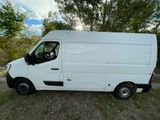 a picture of a white van parked in a field