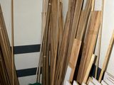 several pieces of wood are stacked on top of each other in a room