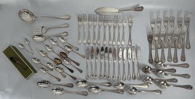 a lot of silver spoons and spoons on the table