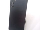 the back of a black phone with a camera on top of it