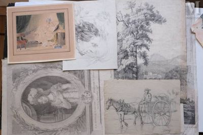 many drawings of horses and carriages on a table