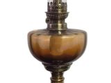 a small oil lamp that is sitting on a table