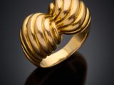 a gold ring with a spiral design on it