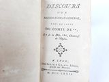 an old book opened on a table with a white background