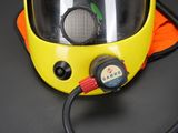 a yellow helmet with a red cord attached to it