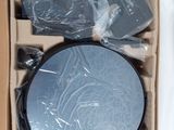 boxed picture of a round mirror in a cardboard box on a table