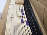 a cardboard box that has a bunch of sticks in it