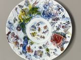 a picture of a plate with a painting on it