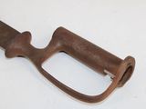 an old rusted metal handle on a white surface
