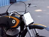 a black and yellow motorcycle parked on the street