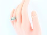 a woman ' s hand with a ring on it ' s finger