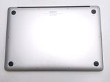 the back of a silver laptop computer sitting on top of a white table