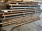 a stack of wooden pallets stacked on top of each other in a warehouse
