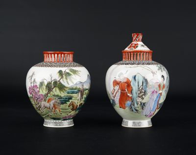 pair of chinese vases with painted scenes on them on a black background