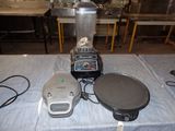 a blender that is sitting on a table next to a pan