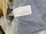 a bag of clothes that is wrapped in plastic