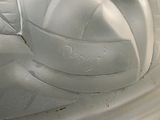 a close up of a white plate with a volleyball ball on it