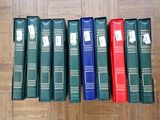 books lined up in a row on a wooden floor