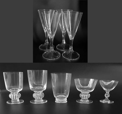 six wine glasses sitting on a table next to each other