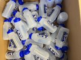 a box full of empty water bottles sitting on the floor