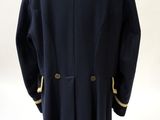 an image of a man ' s coat on a mannequin stand