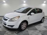 a picture of a white car parked in a garage
