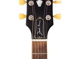 a close up of an electric guitar with a guitar pick up on it