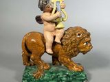 une image représentant une statue de Cupidon jouant de la harpe, perché sur le dos d'un lion