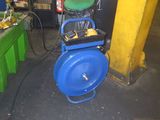 a picture of a blue machine with a bucket on it